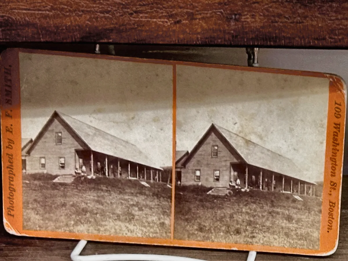 Orange mounted stereo view card of a Maine farmhouse, photographed by E. F. Smith of Boston