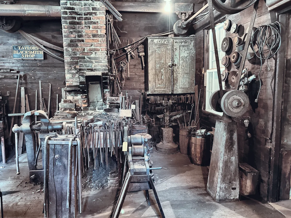 Blacksmith shop interior with tool rack, forge and anvil