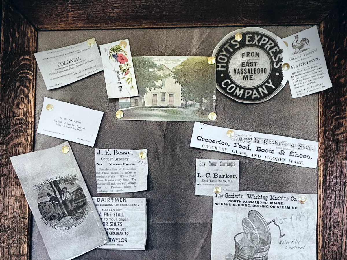 Framed display of nineteenth century Vassalboro business cards and advertisements